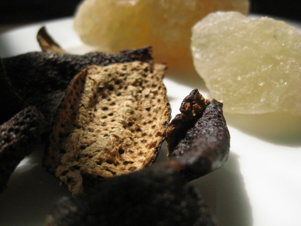 Dark dried tangerine peel (also showing underside) and Chinese rock sugar